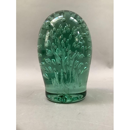 12 - A Victorian green glass dump with bubble inclusions, 15cm high