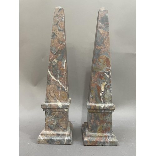 5 - A pair of grey and red marble table obelisks, 33cm high