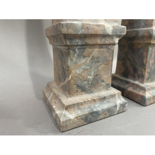 5 - A pair of grey and red marble table obelisks, 33cm high