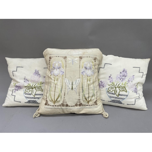 54 - A large silk cushion, the front embroidered with two bearded iris and a butterfly, having rope edgin... 