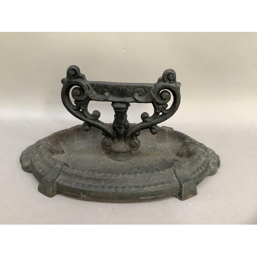 32 - A cast iron boot scraper with oval tray