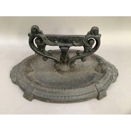 32 - A cast iron boot scraper with oval tray