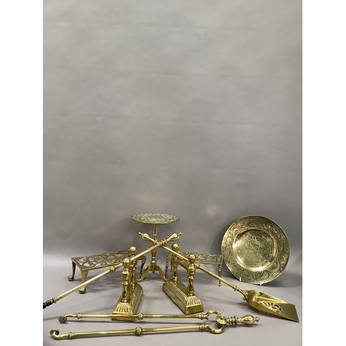 51 - A brass fireside companion set comprising tongs, poker and shovel together with an engraved brass tr... 