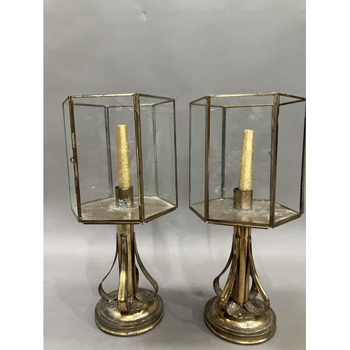 11 - A pair of brass lanterns, having strapwork supports, 40.5cm