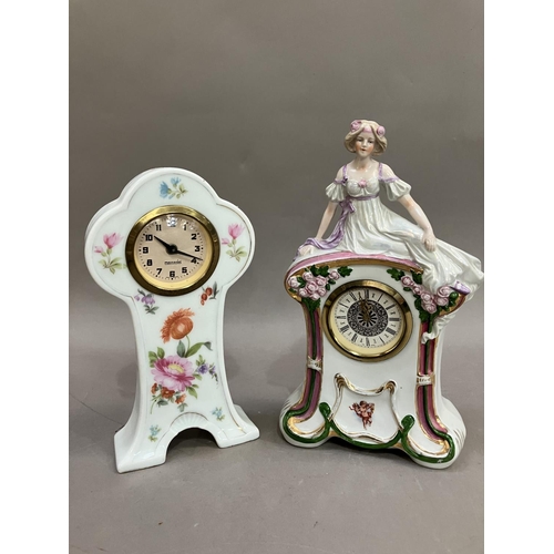 123 - A continental porcelain clock with manual escapement movement, formed as a woman reclining together ... 