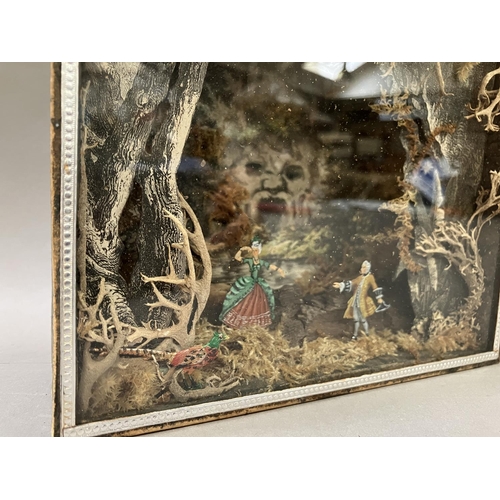 3 - A folk art diorama in glass fronted case, the background having a scene of open mouthed cave, with f... 