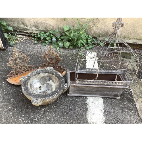 103 - A collection of garden ornaments comprising galvanised tin rectangular planter, two wall mounted bir... 