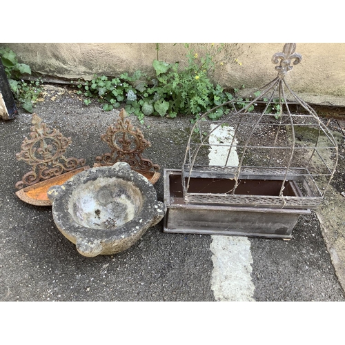 103 - A collection of garden ornaments comprising galvanised tin rectangular planter, two wall mounted bir... 