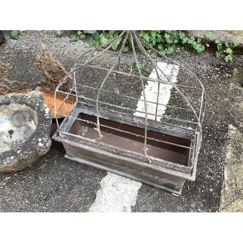 103 - A collection of garden ornaments comprising galvanised tin rectangular planter, two wall mounted bir... 