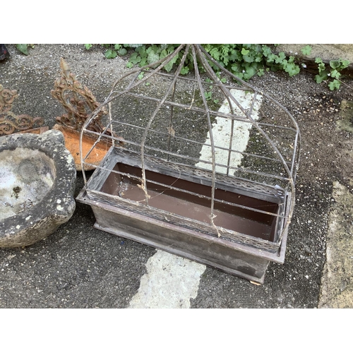 103 - A collection of garden ornaments comprising galvanised tin rectangular planter, two wall mounted bir... 