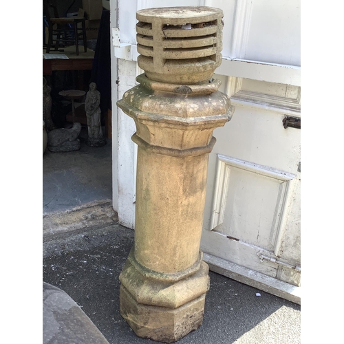 106 - A terracotta chimney pot, stamped base, 131cm high