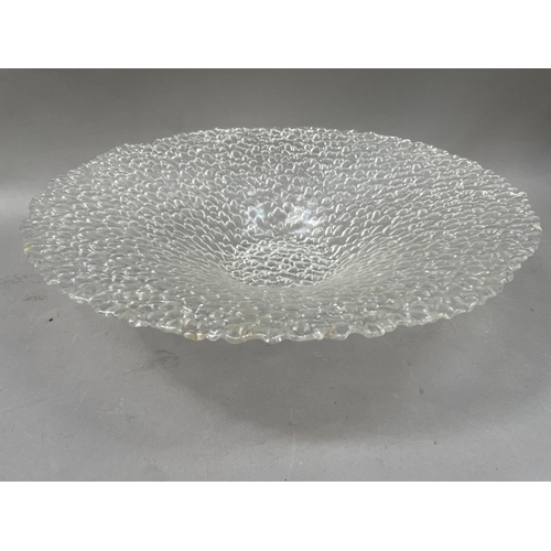 9 - A large, broad-rimmed, textured glass pedestal bowl, in the style of Whitefriars