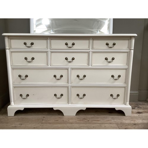 81 - A white painted bank of six short over four long drawers, 141cm wide,  together with a white over ma... 