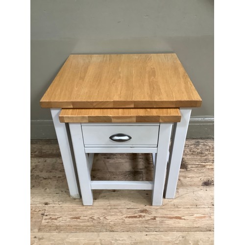 89 - A painted grey and oak nest of two tables, the smaller having a drawer