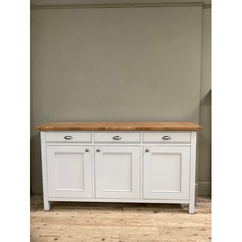 94 - A grey painted and oak topped sideboard having three drawers and three doors with brushed chrome han... 