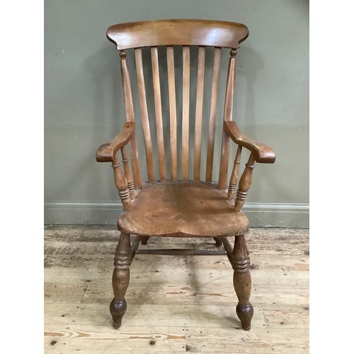 76 - A walnut 19th century kitchen chair on baluster supports and stretcher