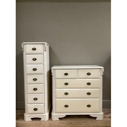 83 - A white, painted wellington chest of seven drawers, together with a chest of two short over three lo... 