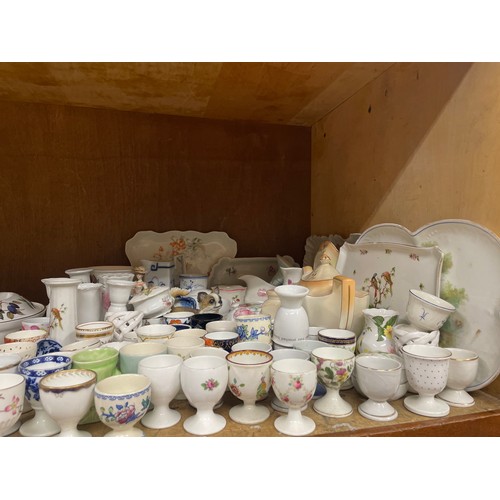 62 - A large collection of ceramic eggcups including Spode, Minton, Mason's etc together with further cer... 