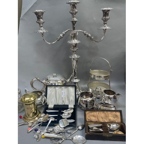 126 - A collection of silver plated ware to include a large candelabra, an egg coddler, a teapot,  sugar b... 