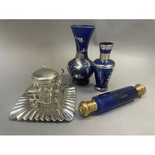 44 - A gilt metal cobalt blue glass double-ended scent bottle, a silver plated topped inkwell and two sma... 