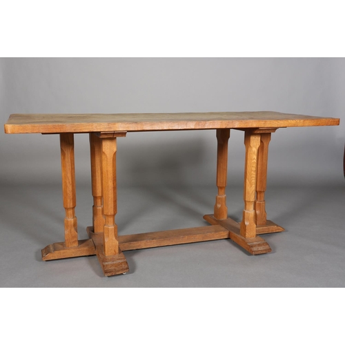 311 - SCHOOL OF THOMPSON OF KILBURN, An adzed oak rectory table c.1940s on triple chamfered leg standards,... 