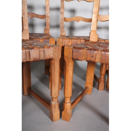 312 - SCHOOL OF THOMPSON OF KILBURN, A set of six oak dining chairs, c.1940s, having an ogee arched top ra... 