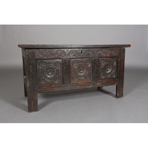 381 - A LATE 17TH/EARLY 18TH CENTURY OAK JOINED CHEST having a triple indented panel top above a frieze ca... 