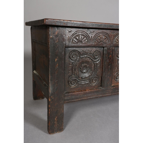 381 - A LATE 17TH/EARLY 18TH CENTURY OAK JOINED CHEST having a triple indented panel top above a frieze ca... 