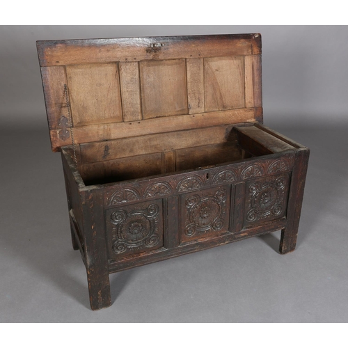 381 - A LATE 17TH/EARLY 18TH CENTURY OAK JOINED CHEST having a triple indented panel top above a frieze ca... 