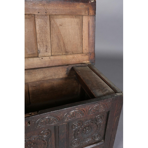 381 - A LATE 17TH/EARLY 18TH CENTURY OAK JOINED CHEST having a triple indented panel top above a frieze ca... 