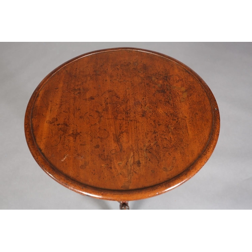 338 - A MID 19TH CENTURY MAHOGANY CIRCULAR TRIPOD TABLE having a recessed surface on a fluted and foliate ... 