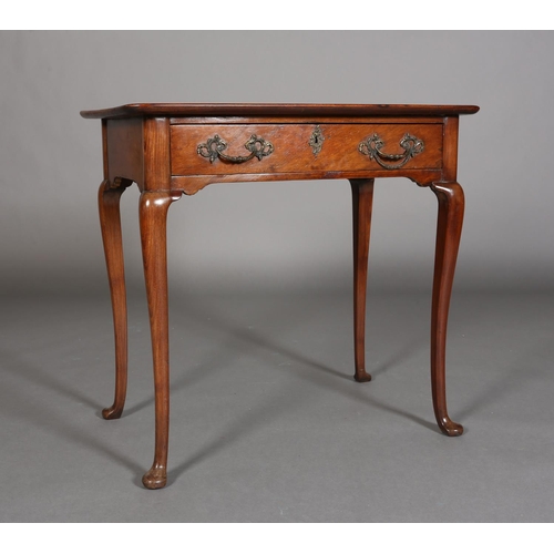 328 - A GEORGE III STYLE WALNUT SIDE TABLE with lipped surface above a frieze drawer, gilt rococco handles... 