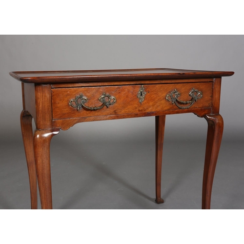 328 - A GEORGE III STYLE WALNUT SIDE TABLE with lipped surface above a frieze drawer, gilt rococco handles... 