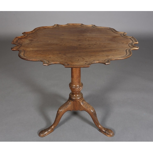 329 - A GEORGE III MAHOGANY TILT TOP TABLE, circular bracketed outline with moulded rim, on writhen turned... 