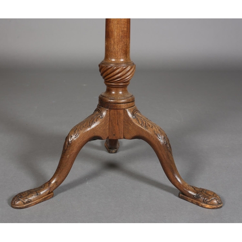 329 - A GEORGE III MAHOGANY TILT TOP TABLE, circular bracketed outline with moulded rim, on writhen turned... 