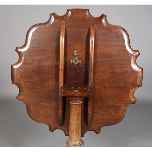 329 - A GEORGE III MAHOGANY TILT TOP TABLE, circular bracketed outline with moulded rim, on writhen turned... 