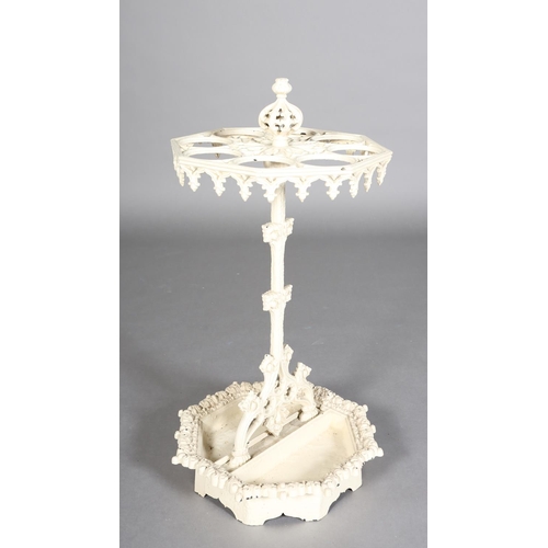 83 - A VICTORIAN CREAM PAINTED CAST IRON STICK STAND of octagonal outline, with pierced finial and pendan... 