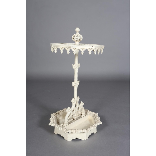 83 - A VICTORIAN CREAM PAINTED CAST IRON STICK STAND of octagonal outline, with pierced finial and pendan... 