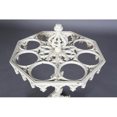 83 - A VICTORIAN CREAM PAINTED CAST IRON STICK STAND of octagonal outline, with pierced finial and pendan... 