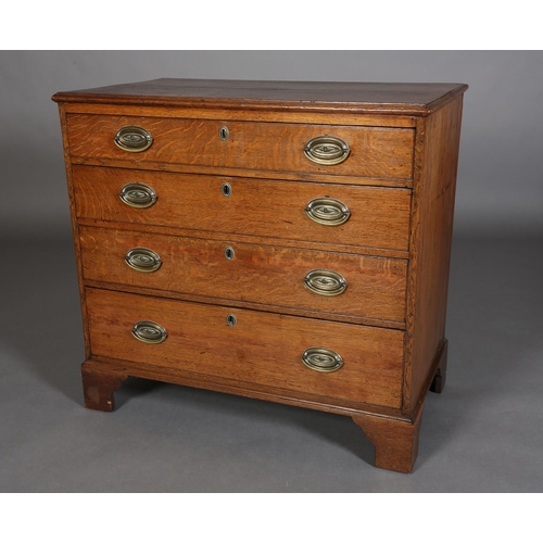 375 - AN EARLY 19TH CENTURY OAK CHEST of four graduated drawers with seashell embossed brass oval back pla... 