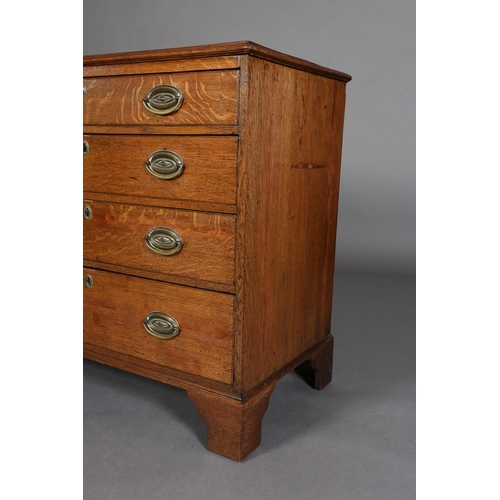 375 - AN EARLY 19TH CENTURY OAK CHEST of four graduated drawers with seashell embossed brass oval back pla... 