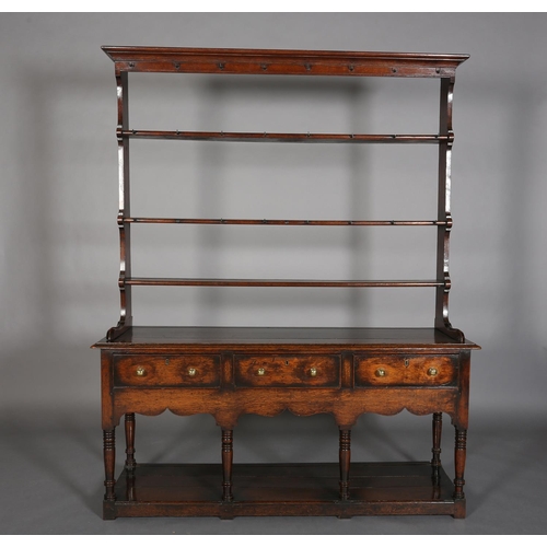 376 - A LATE 18TH CENTURY OAK DRESSER AND RACK, having a moulded cornice above three open shelves, the dre... 