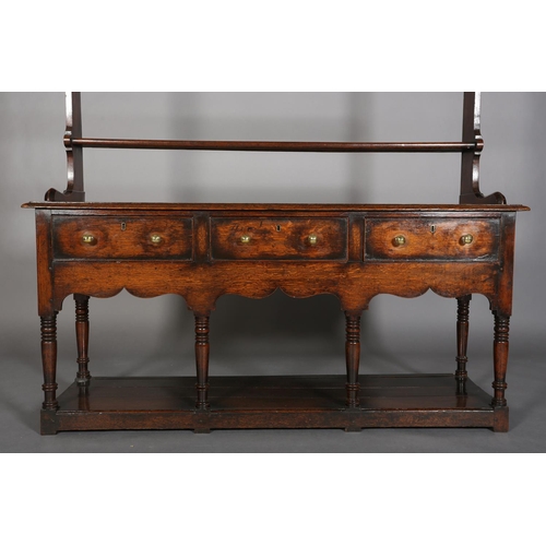 376 - A LATE 18TH CENTURY OAK DRESSER AND RACK, having a moulded cornice above three open shelves, the dre... 