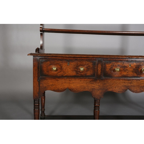 376 - A LATE 18TH CENTURY OAK DRESSER AND RACK, having a moulded cornice above three open shelves, the dre... 