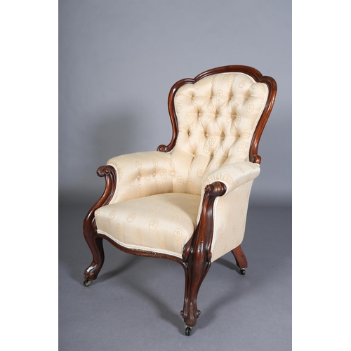 340 - A VICTORIAN MAHOGANY ARMCHAIR HAVING AN ENCIRCLING FRAME, button backed pale apricot fabric upholste... 