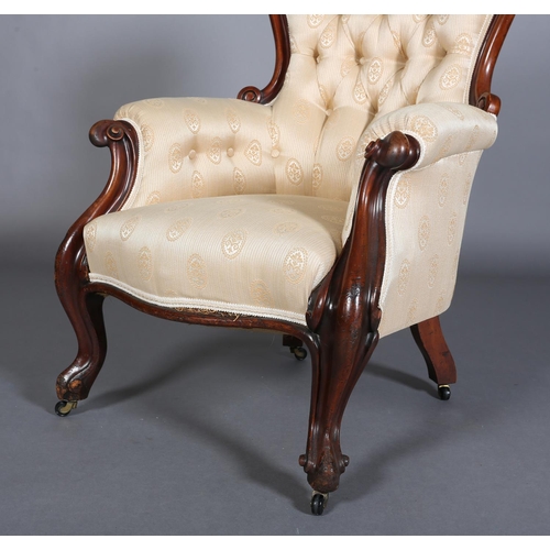 340 - A VICTORIAN MAHOGANY ARMCHAIR HAVING AN ENCIRCLING FRAME, button backed pale apricot fabric upholste... 