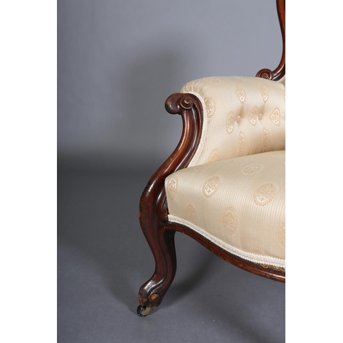 340 - A VICTORIAN MAHOGANY ARMCHAIR HAVING AN ENCIRCLING FRAME, button backed pale apricot fabric upholste... 