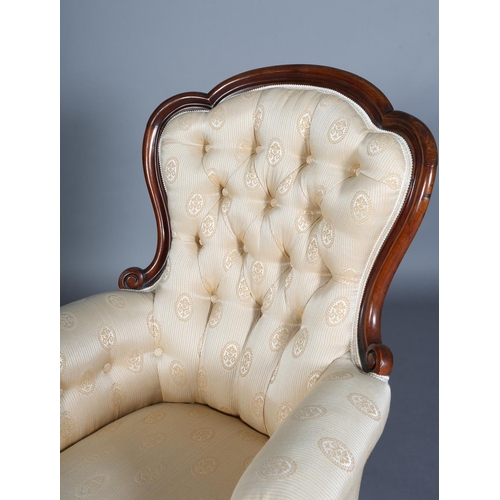 340 - A VICTORIAN MAHOGANY ARMCHAIR HAVING AN ENCIRCLING FRAME, button backed pale apricot fabric upholste... 