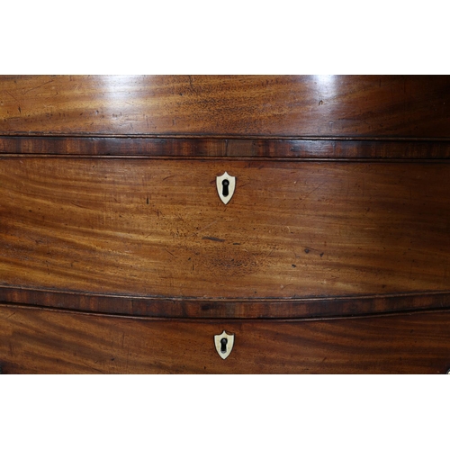 344 - AN 18TH CENTURY MAHOGANY SERPENTINE FRONTED CHEST of four long graduated drawers with oval brass bac... 