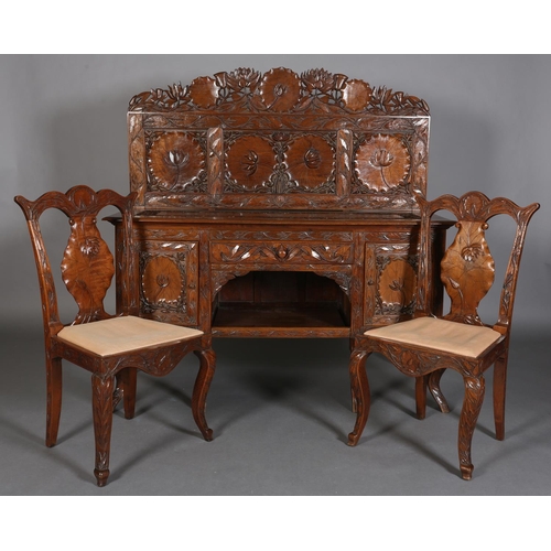 324 - A LATE 19TH CENTURY ANGLO-INDIAN WALNUT SIDEBOARD AND PAIR OF SINGLE CHAIRS, all-over carved in low ... 